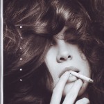 The cover of a magazine with a woman smoking a cigarette.