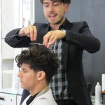 A man cutting a man's hair.