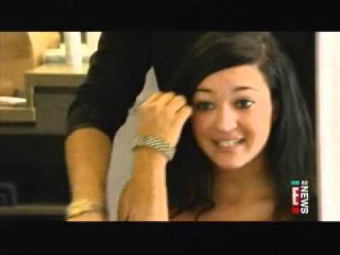 A woman is getting her hair done in a salon.