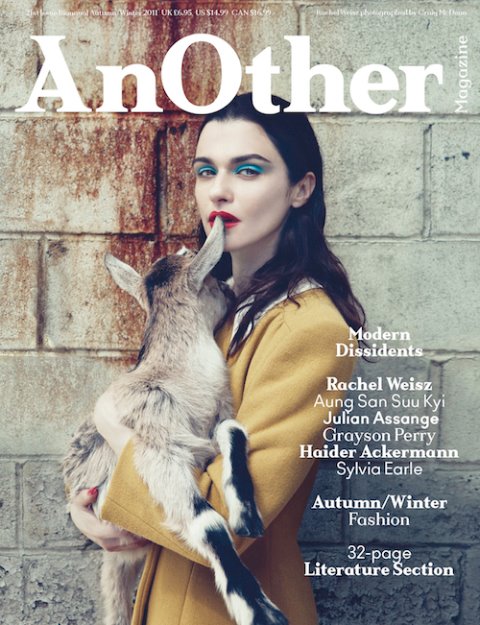 A woman holding a goat on the cover of another magazine.