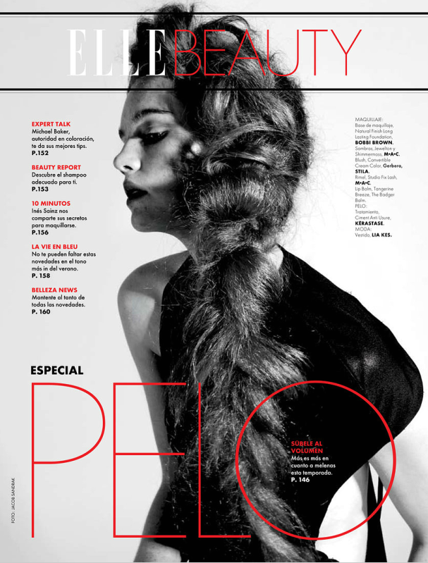 The cover of elle beauty featuring a woman with long hair.