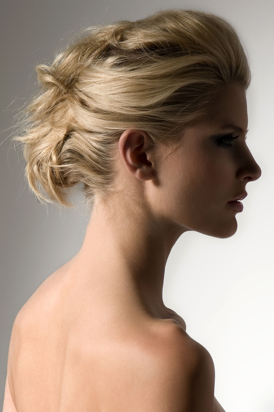 A woman with blond hair in an updo.