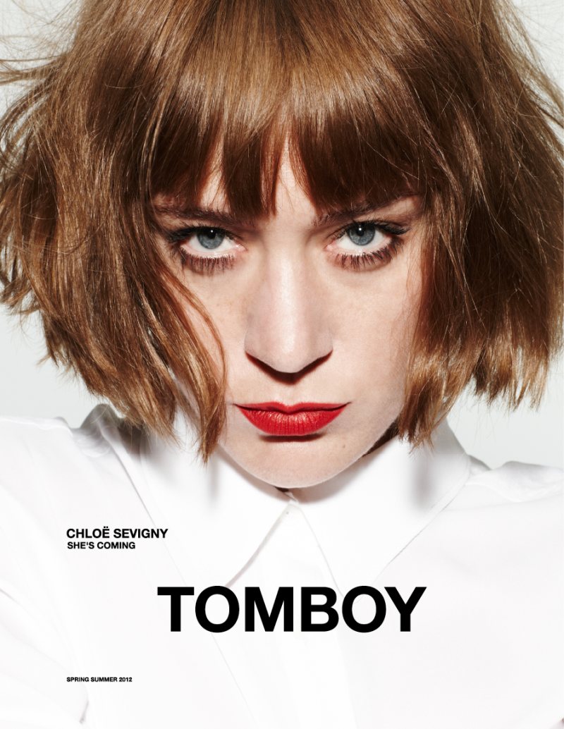 The cover of tomboy magazine with a woman in a white shirt.