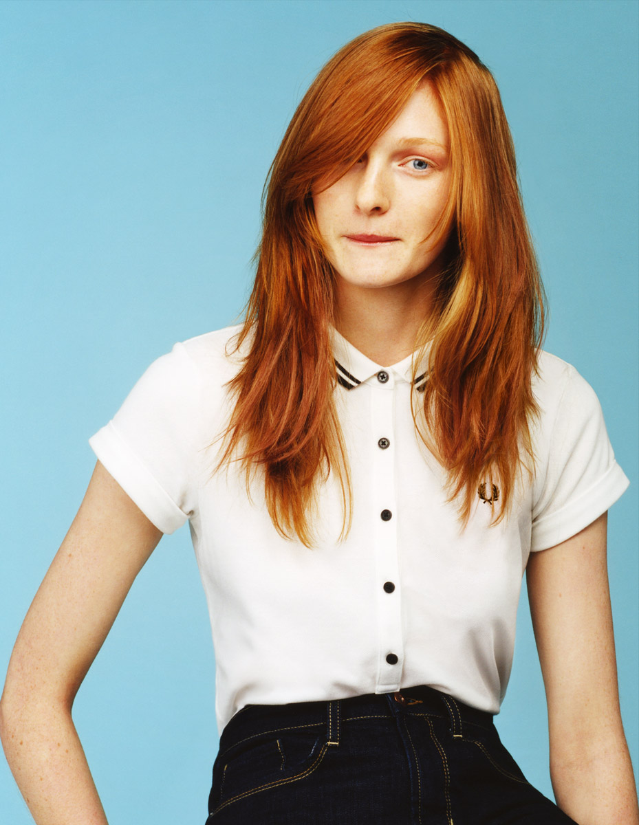 A woman wearing a white shirt and jeans.