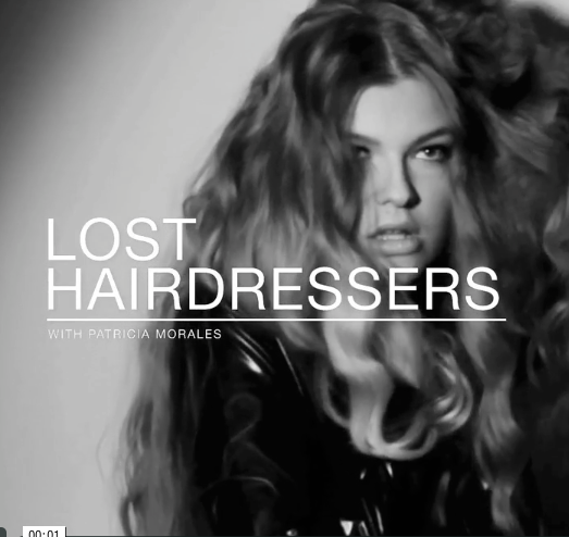 A black and white photo of a woman with long hair and the words lost hairdressers.