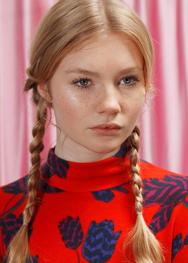 A woman with braids in her hair.