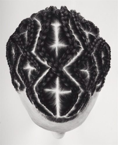 A black and white photo of a woman's head with braids.