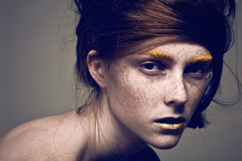 A woman with freckles on her face.