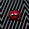 A black and white enamel pin with "Lips" enamel lapel pin by LH™ on it.