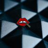 Lips" an enamel lapel pin by LH™ with a red lips on it.